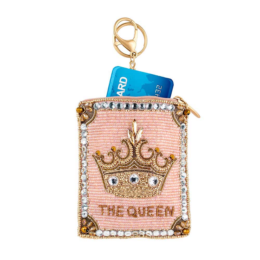 Pink cardholder with gold crown design and 'The Queen' text on a white background